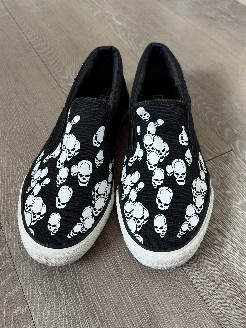 Converse Kids Black Slip-On Sneakers with White Skull Print